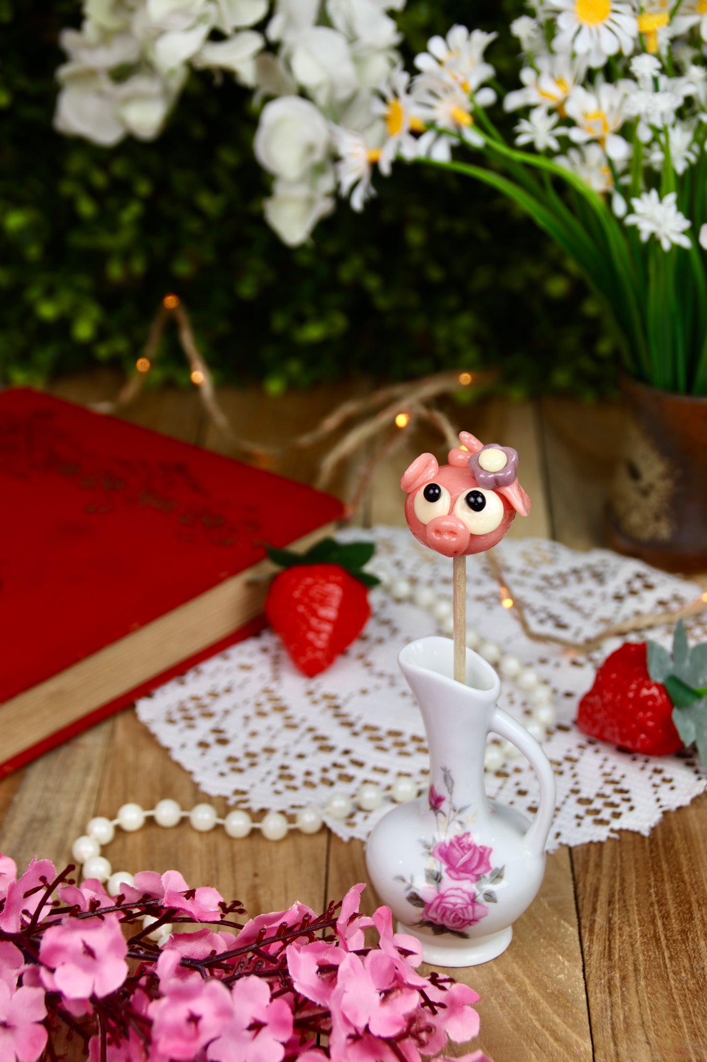 Sucette cochon avec fleur