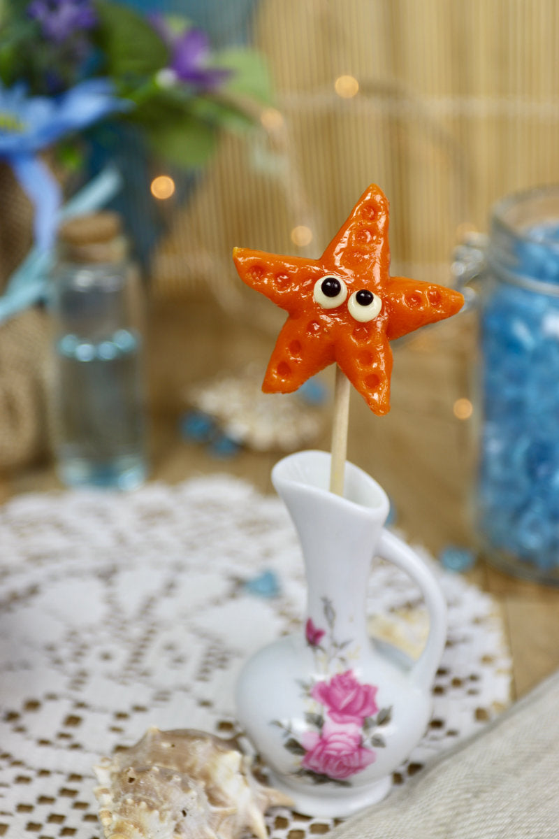 Sucette artisanale en forme d’étoile de mer, sculptée à la main, parfum melon