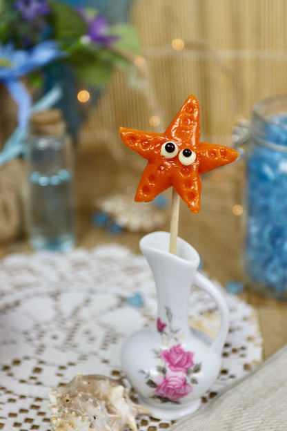 Sucette artisanale en forme d’étoile de mer, sculptée à la main, parfum melon