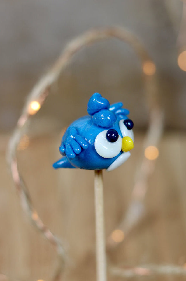 Sucette sculptée en forme d'oiseau à la myrtille et au citron