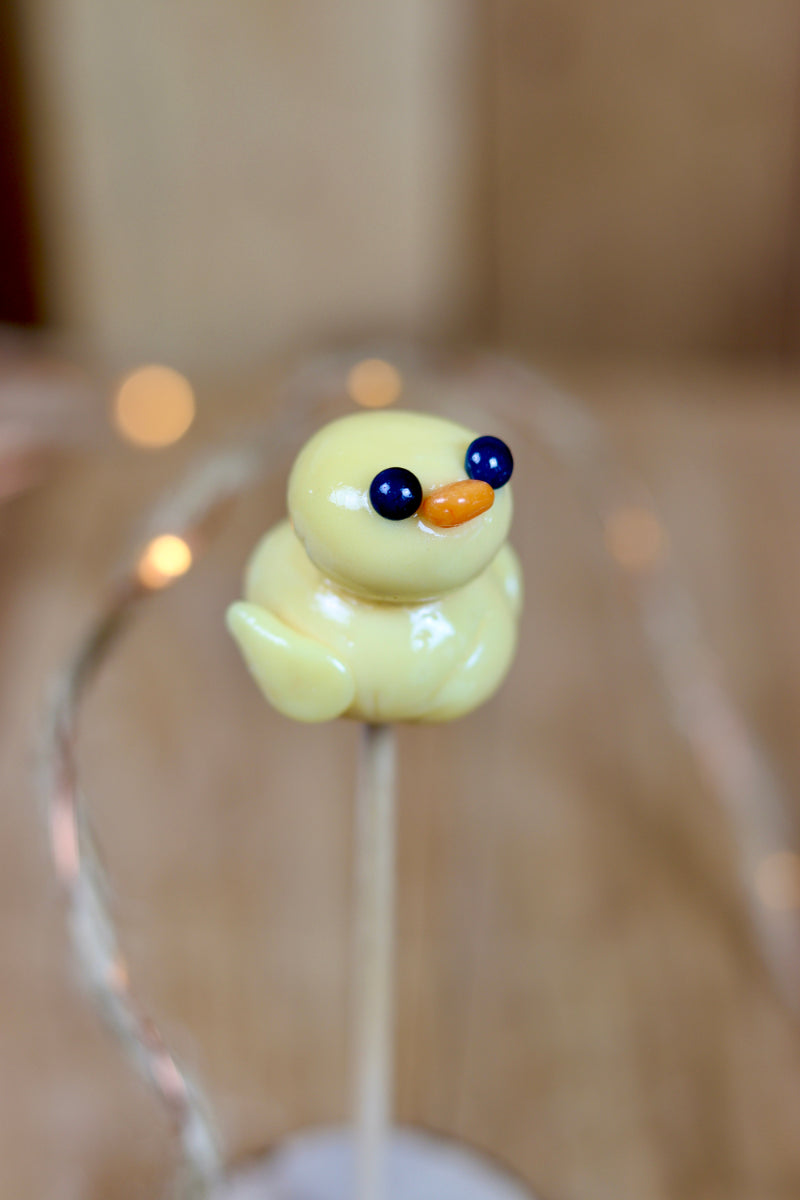 Sucette sculptée en forme de canard à la pêche