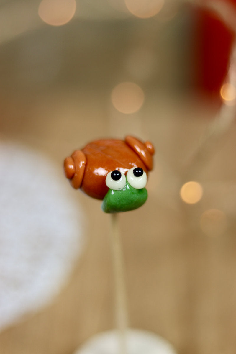 Sucette sculptée en forme d'escargot à la pomme et au caramel