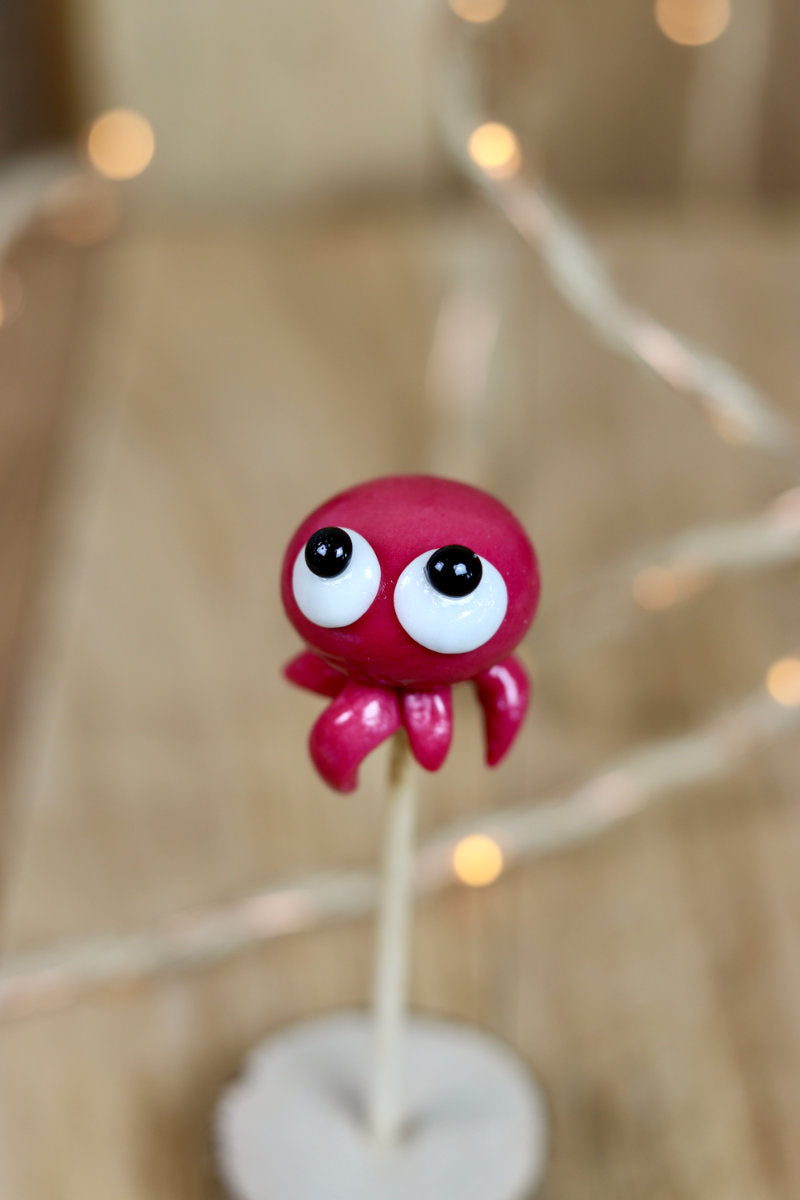 Sucette sculptée en forme de pieuvre à la cerise