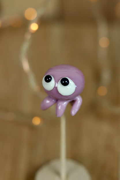 Sucette sculptée en forme de pieuvre à la violette