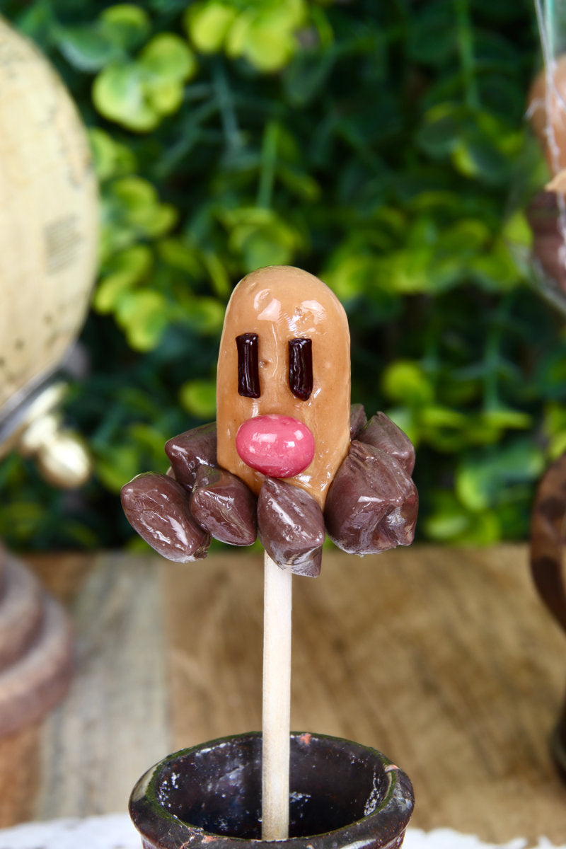 Sucette en forme de taupiqueur au cola et à la cerise