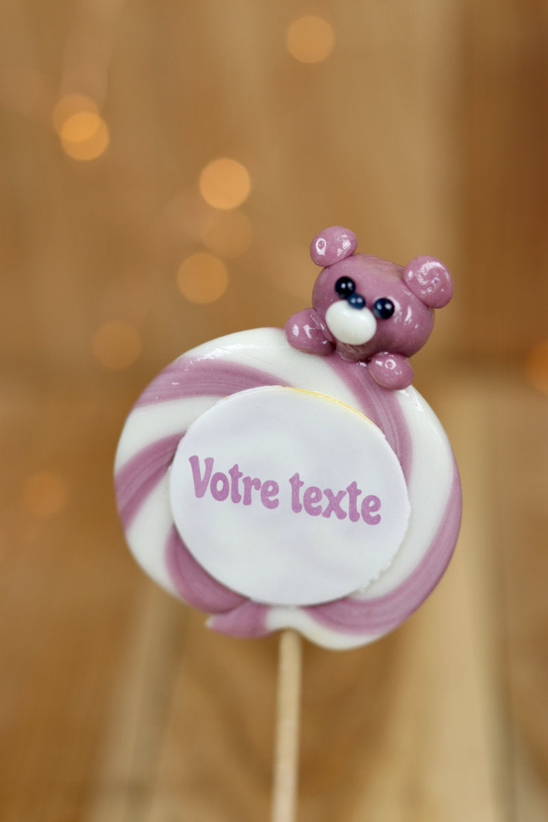 Une sucette imprimée à personnaliser au citron et à la violette avec une peluche sculptée dessus 