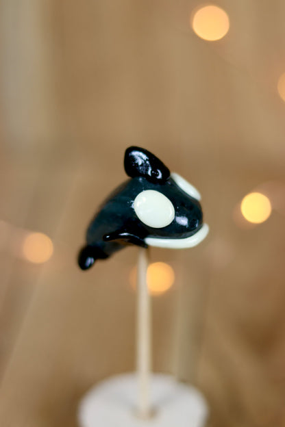 Sucette sculptée en forme d'orque à la vanille et au cola